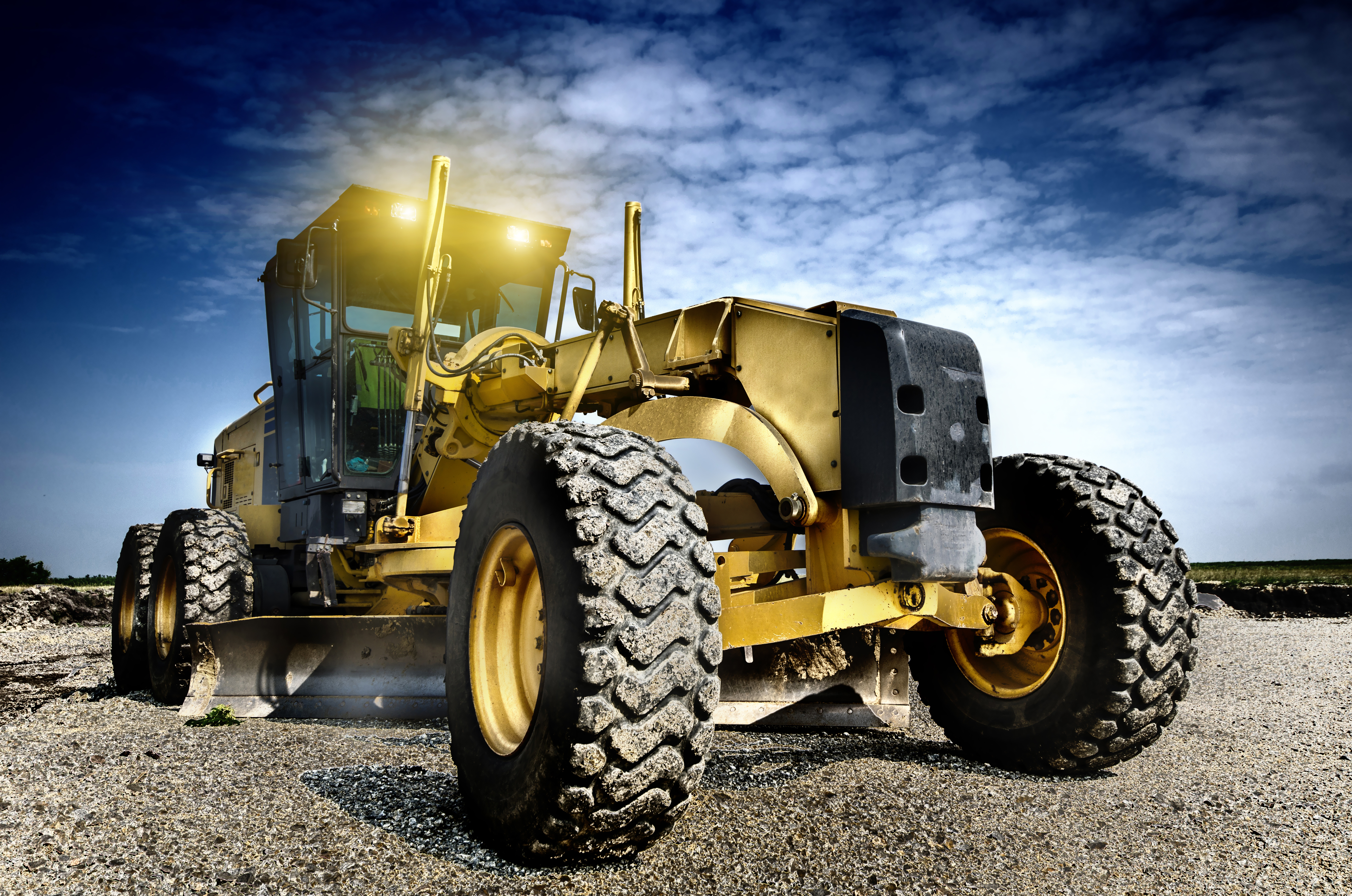 Motor grader used in active civil field operations